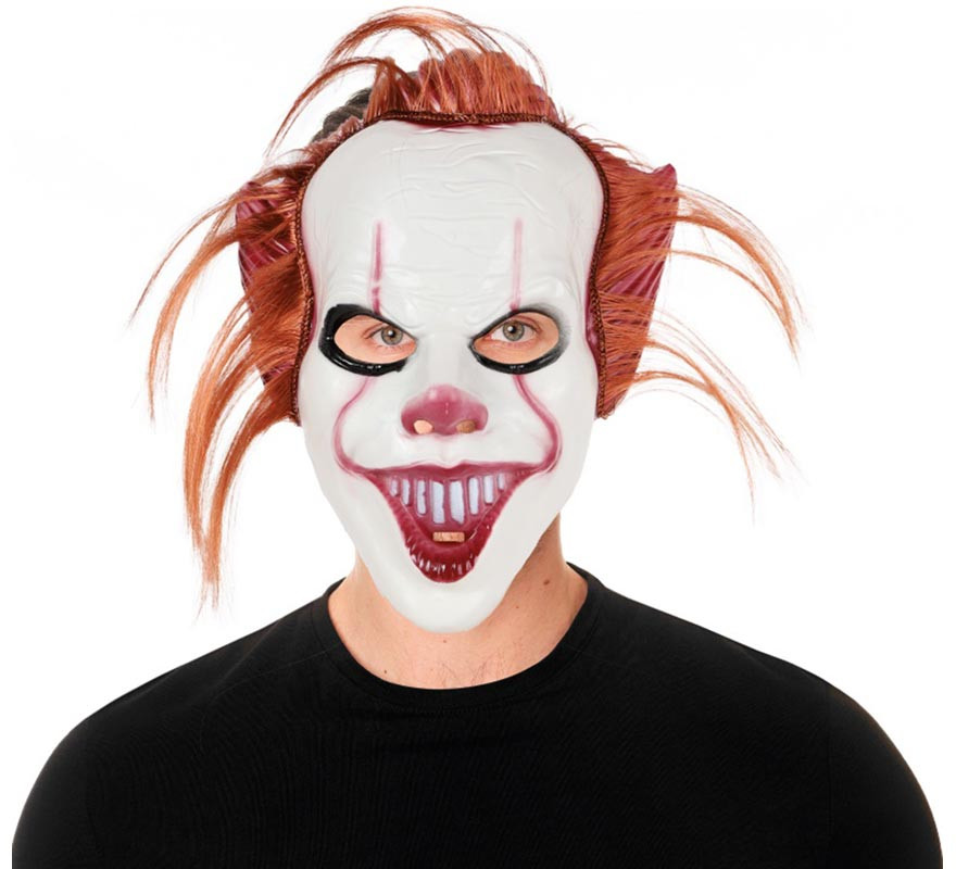 Clown mask with red plastic hair